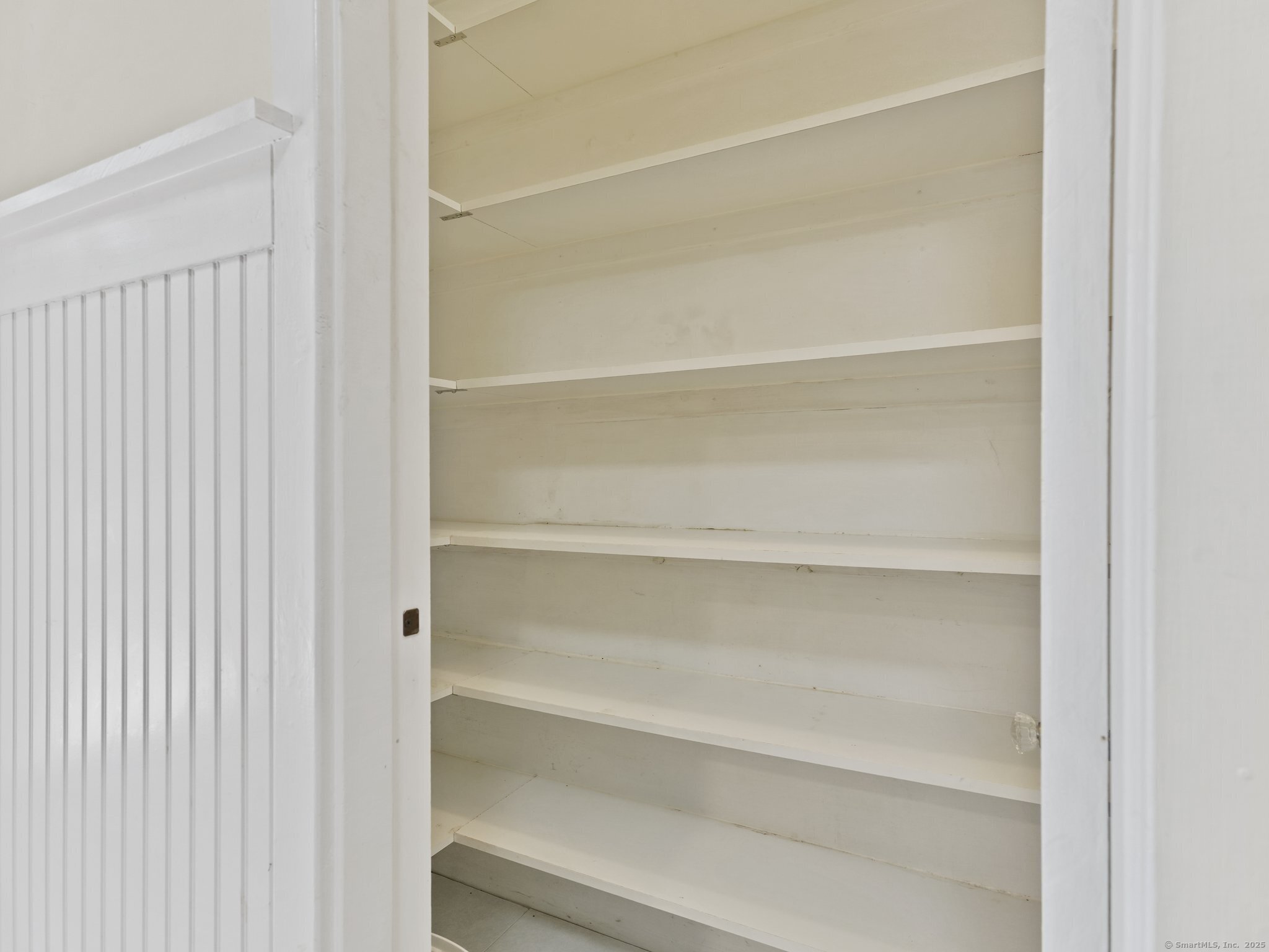 355 Main Street Old Saybrook, CT 06475 - Photo 15 of 29 a view of walk in closet with empty racks