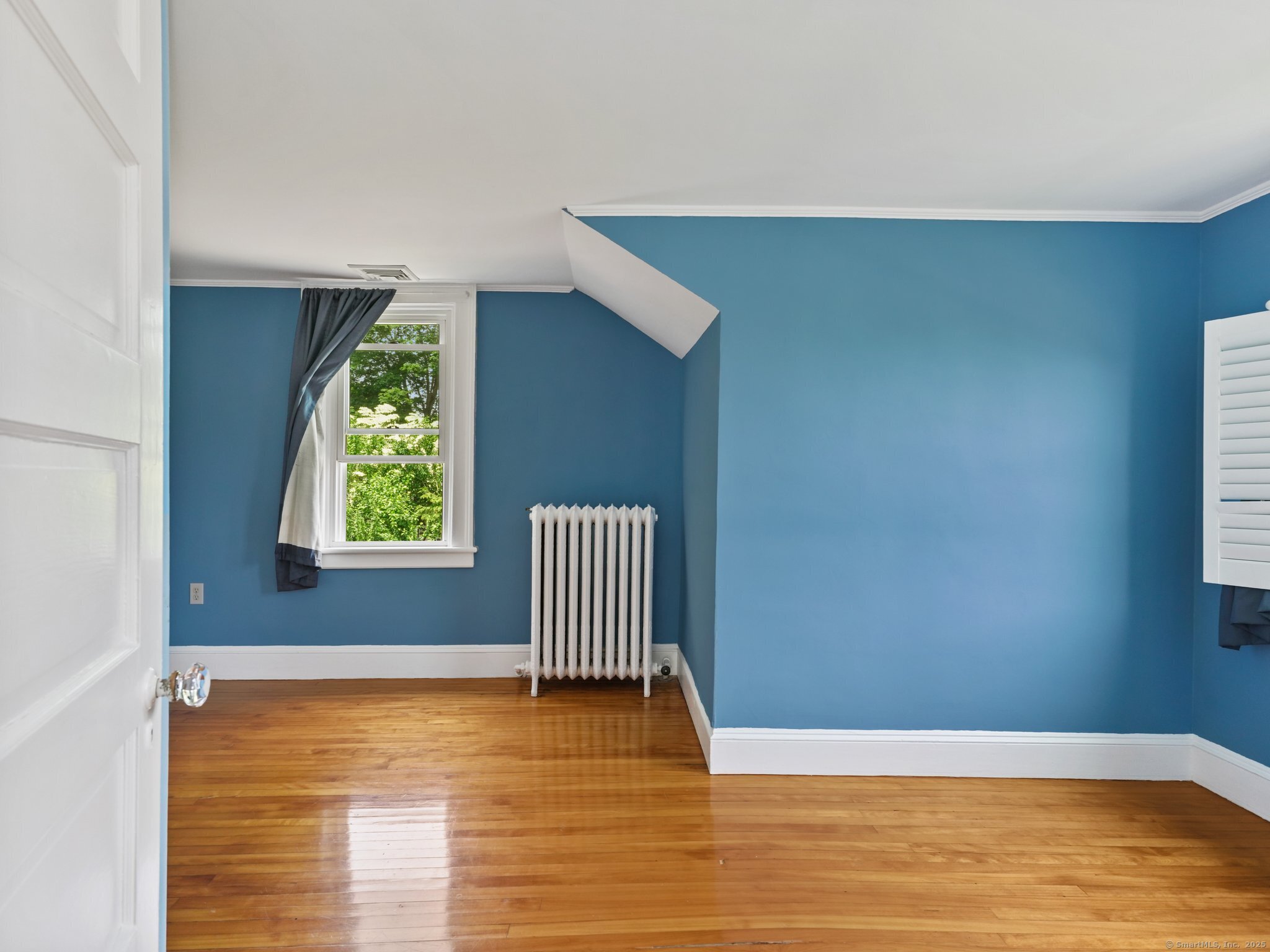 355 Main Street Old Saybrook, CT 06475 - Photo 20 of 29 a view of an empty room with wooden floor and a window