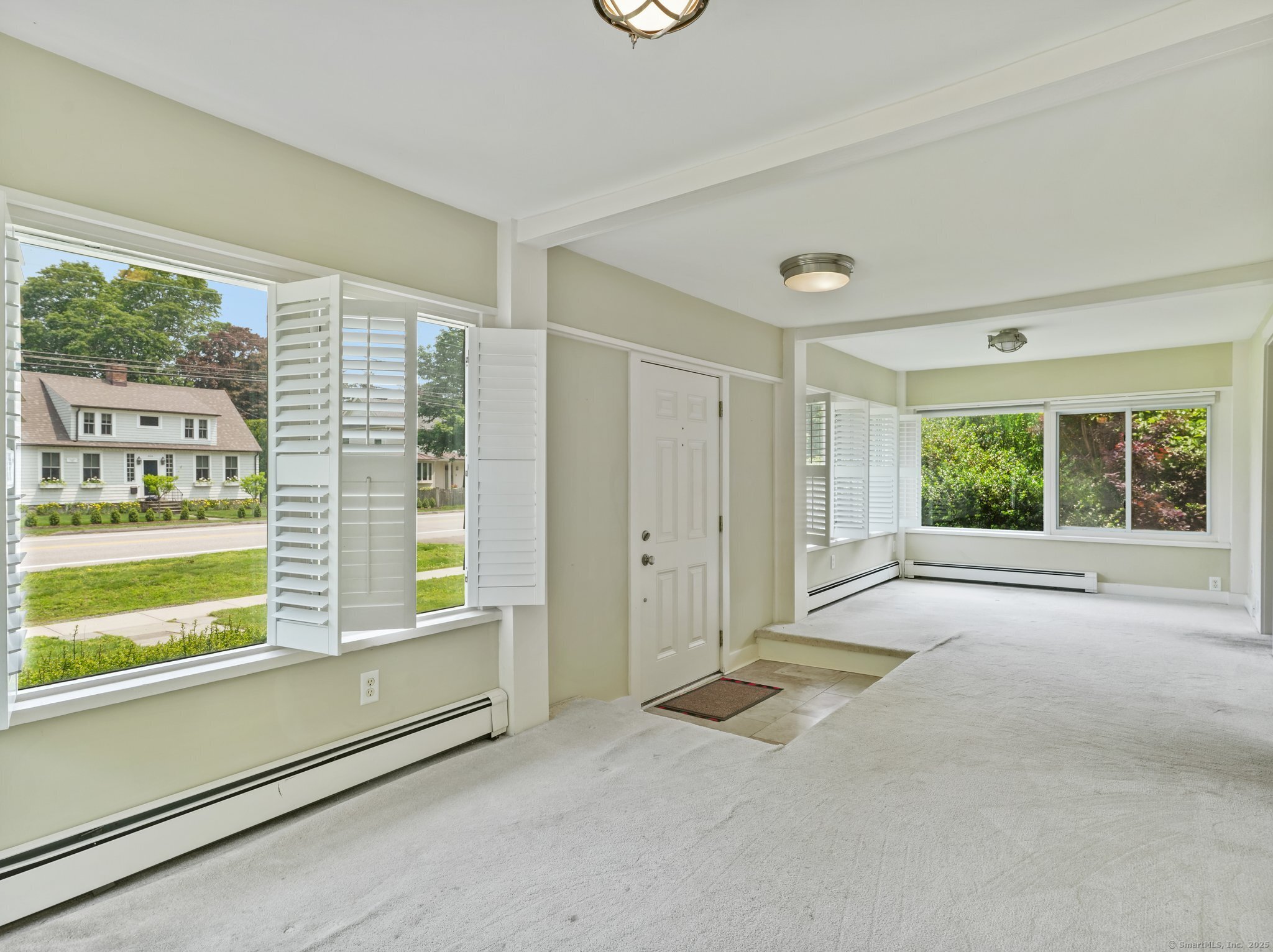 355 Main Street Old Saybrook, CT 06475 - Photo 2 of 29 a view of an empty room with a window