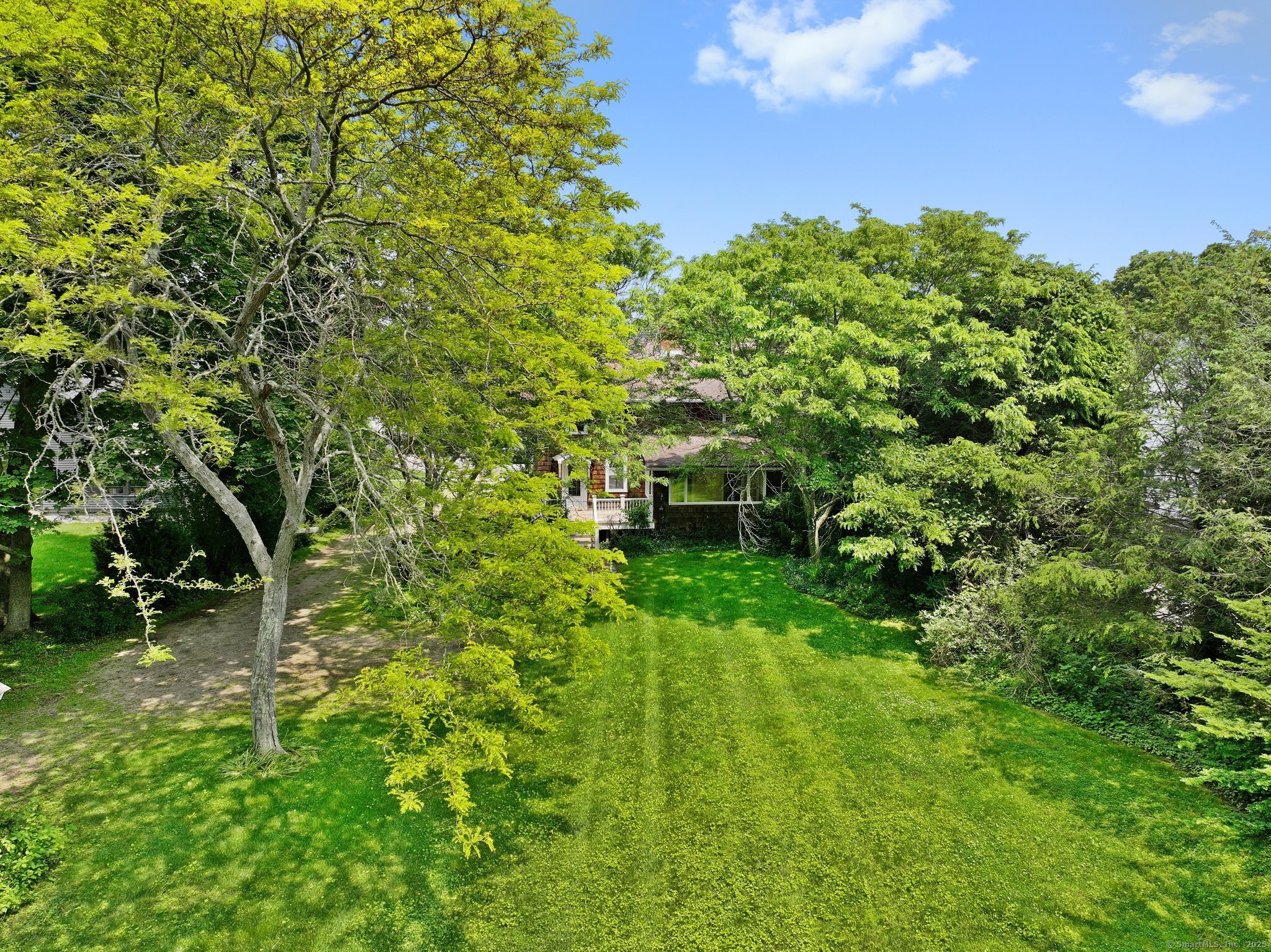 355 Main Street Old Saybrook, CT 06475 - Photo 28 of 29 a backyard of a house with a table and chairs