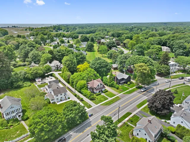 an aerial view of a houses with a yard