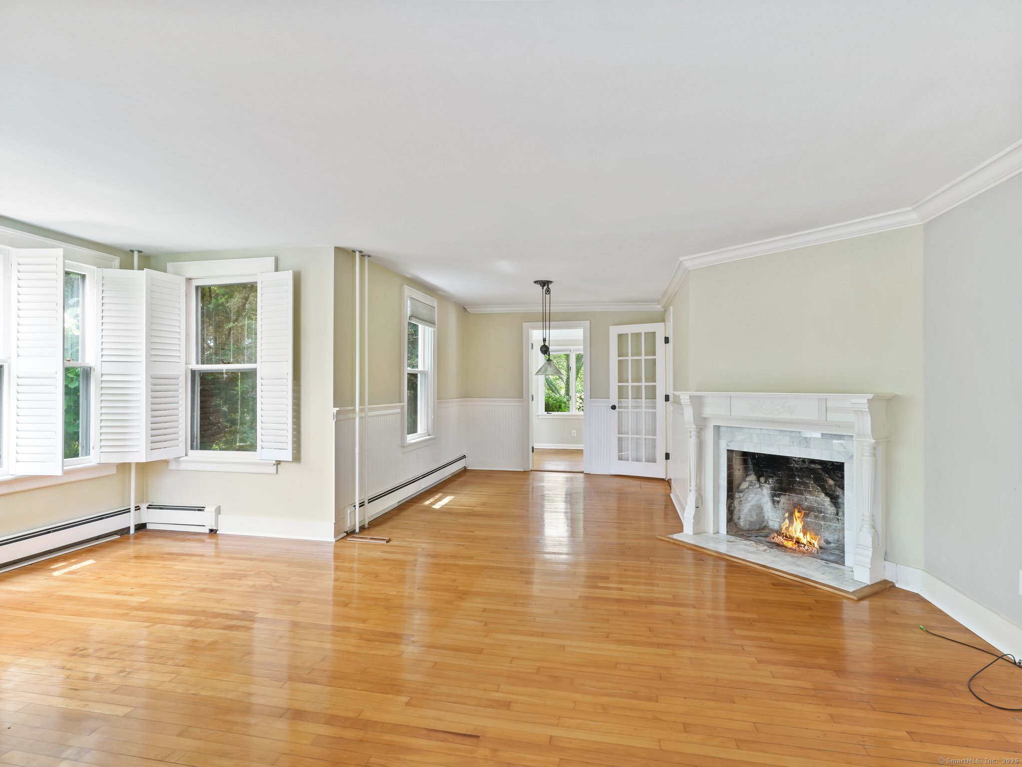 355 Main Street Old Saybrook, CT 06475 - Photo 6 of 29 a view of an empty room with glass door and windows