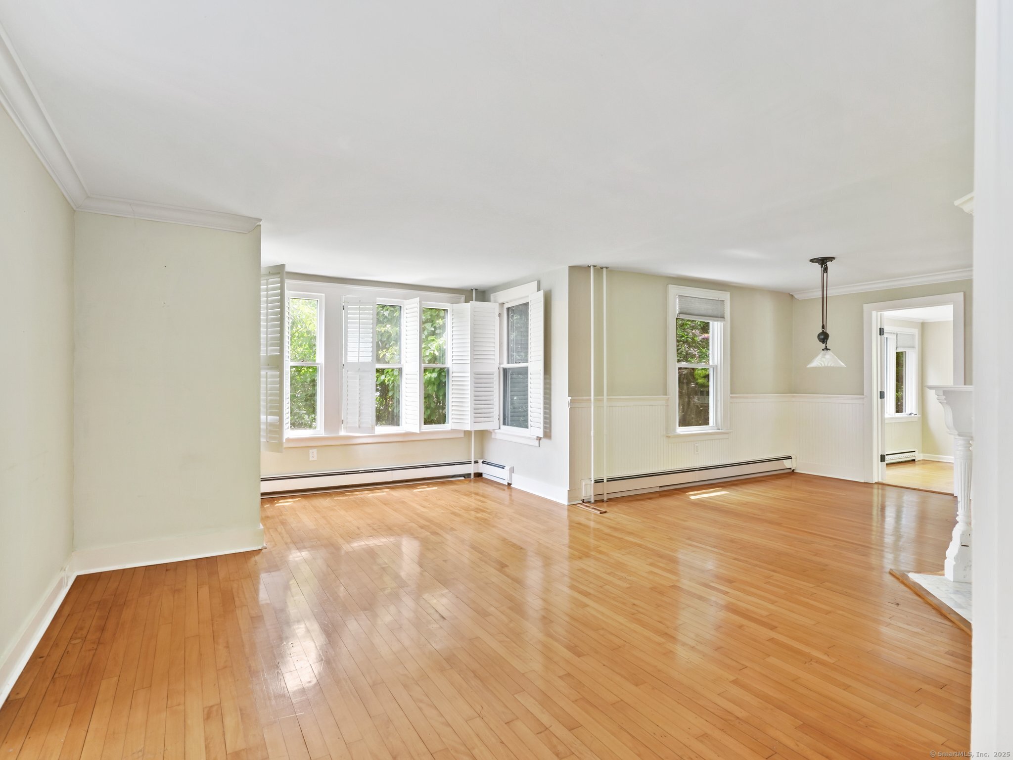 355 Main Street Old Saybrook, CT 06475 - Photo 7 of 29 a view of an empty room with wooden floor and a window