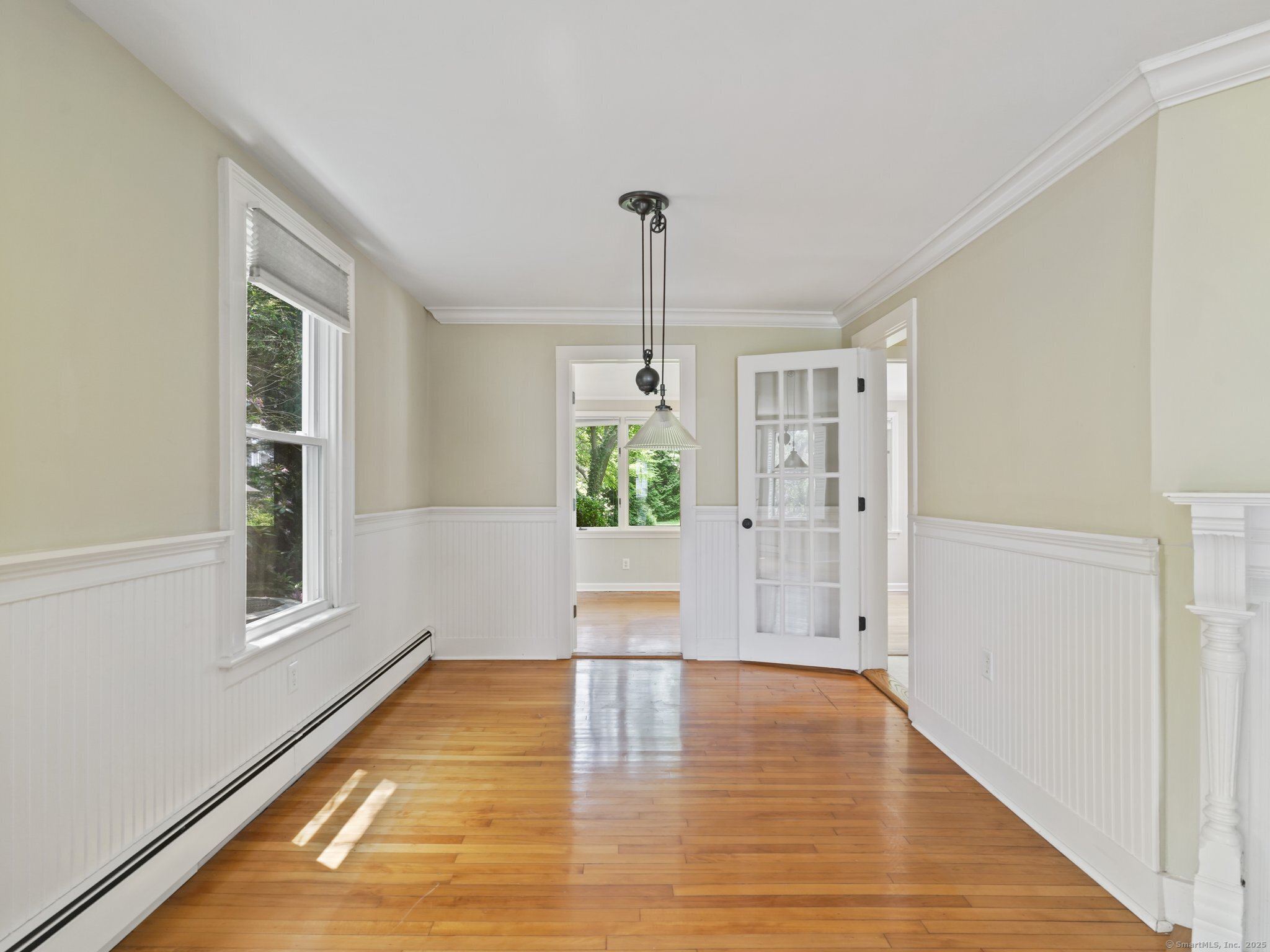 355 Main Street Old Saybrook, CT 06475 - Photo 8 of 29 a view of an empty room with wooden floor and a window