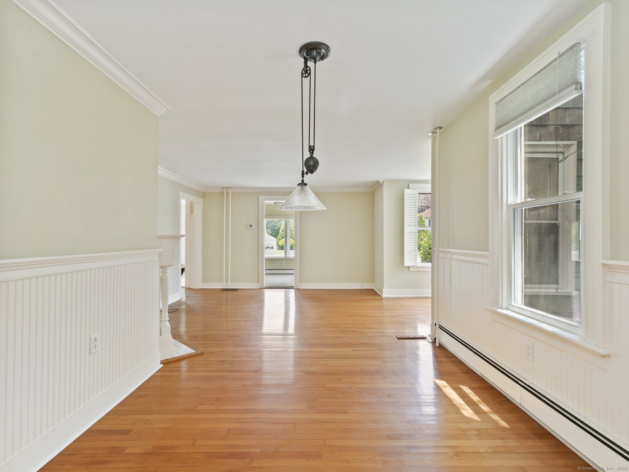 355 Main Street Old Saybrook, CT 06475 - Photo 9 of 29 a view of a room with wooden floor closet and a ceiling fan