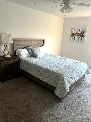 a bedroom with a bed and a table in it
