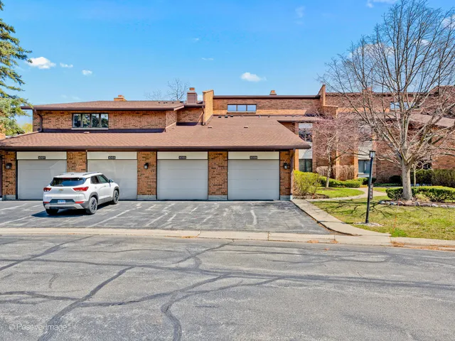 a front view of a building with garden