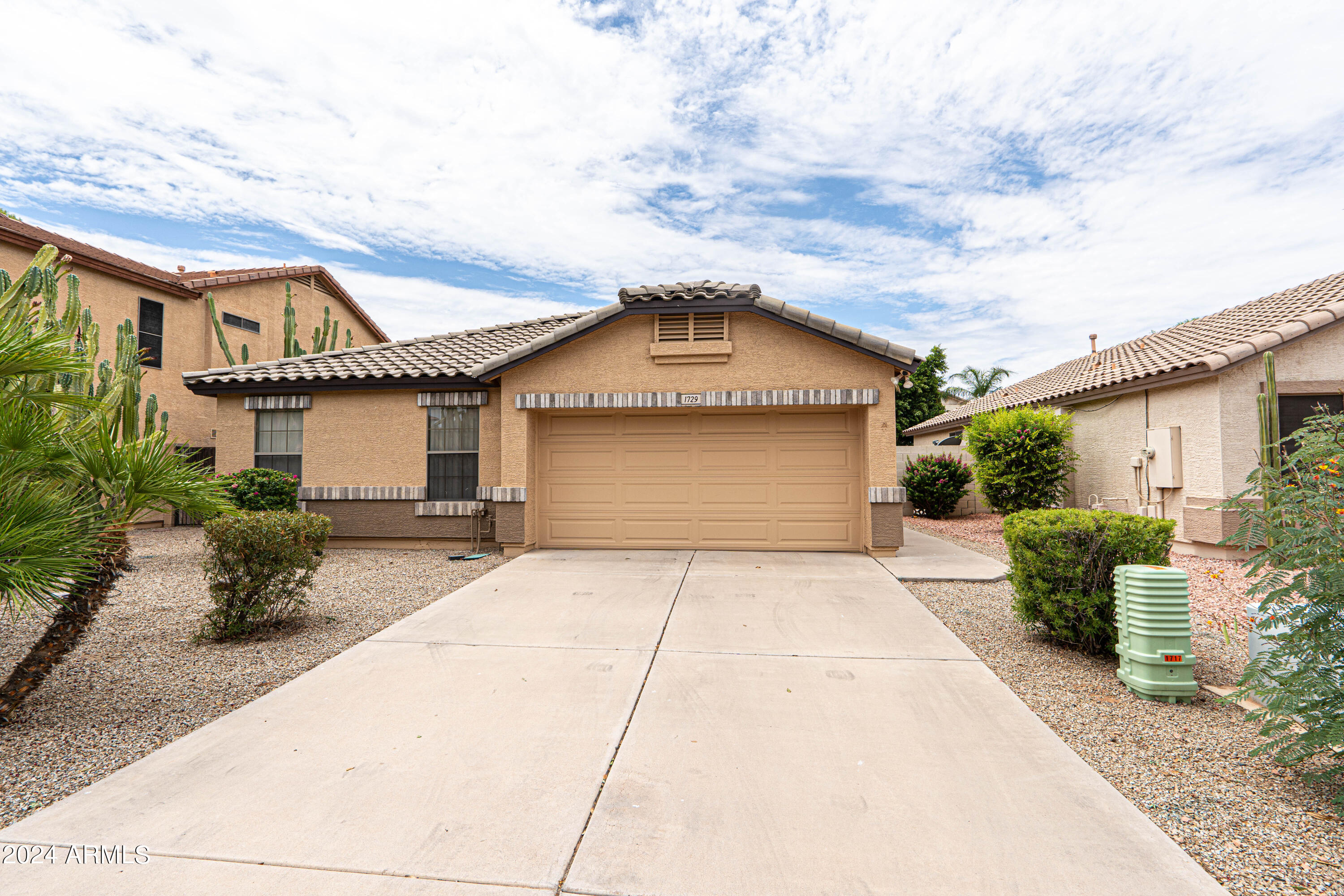 1729 East Del Rio Street Gilbert, AZ 85295 - Photo 1 of 19 front view of a house with a patio