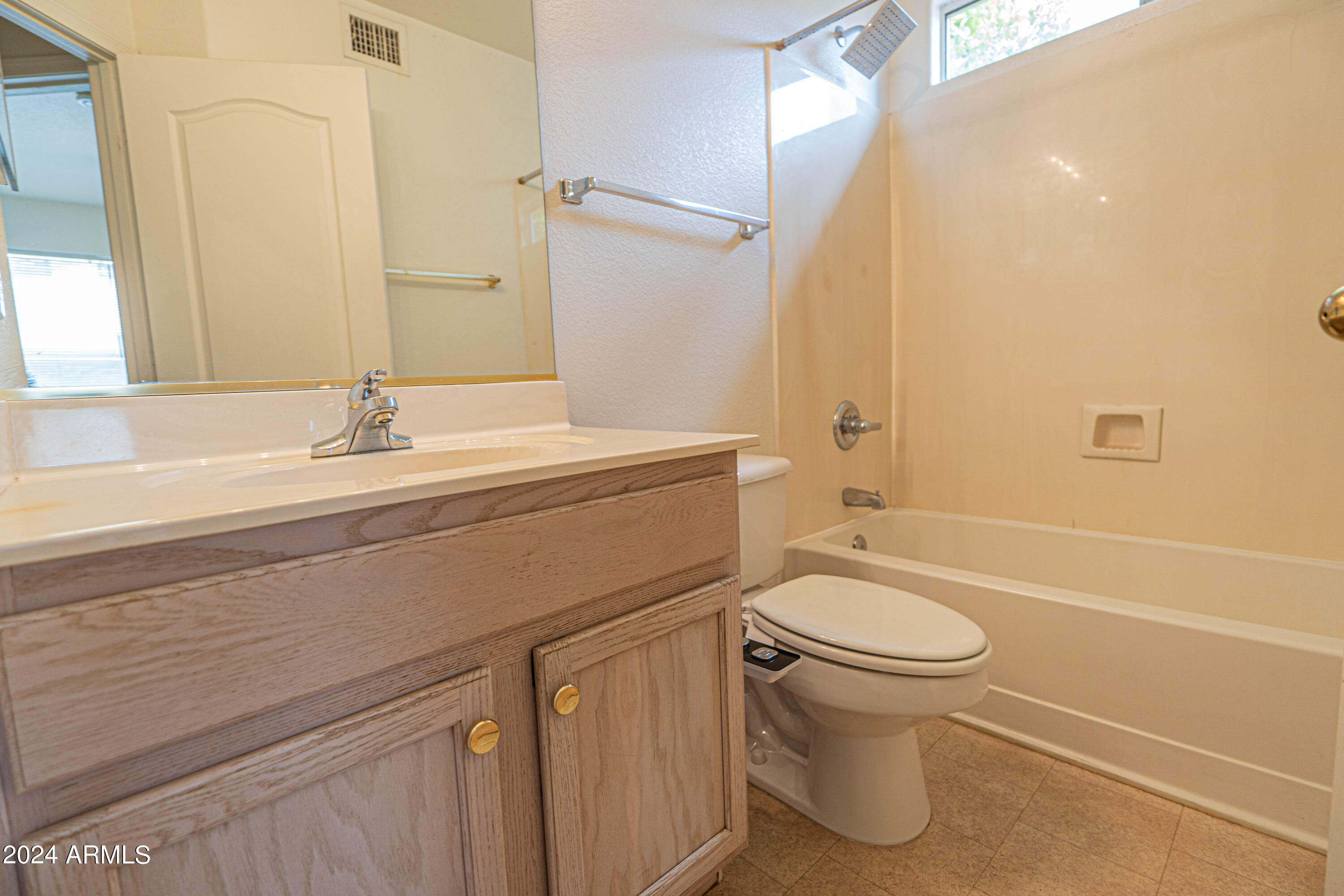 1729 East Del Rio Street Gilbert, AZ 85295 - Photo 18 of 19 a bathroom with a sink a toilet and a bathtub