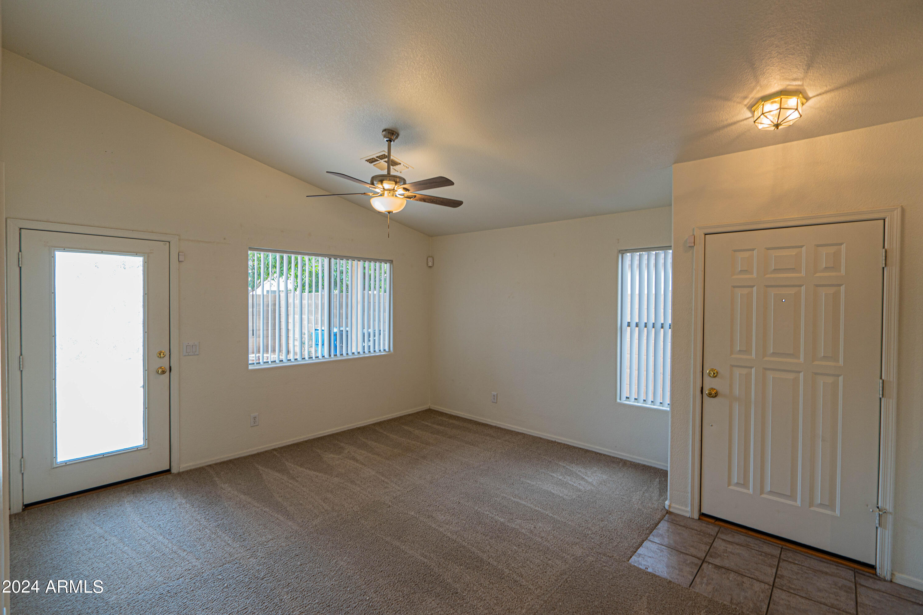 1729 East Del Rio Street Gilbert, AZ 85295 - Photo 2 of 19 a view of an empty room with a window