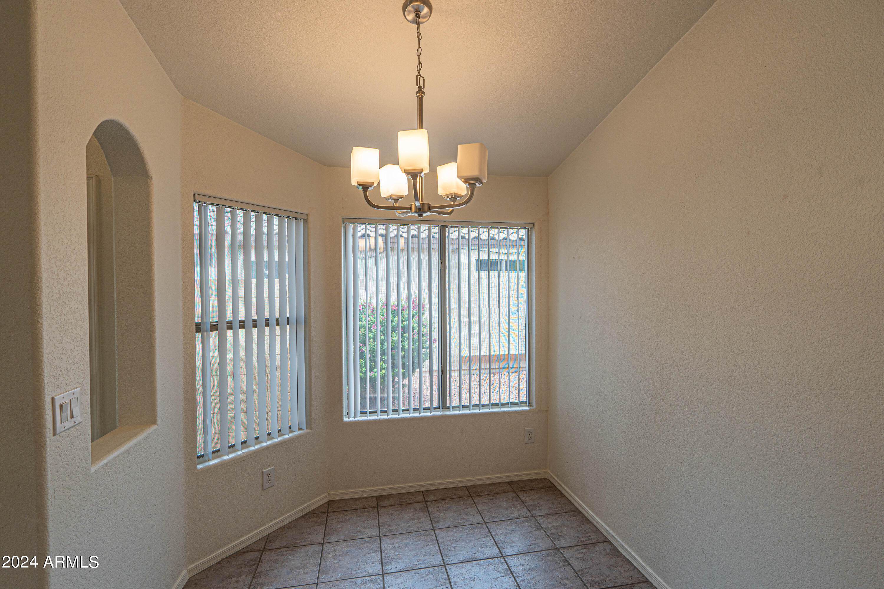 1729 East Del Rio Street Gilbert, AZ 85295 - Photo 8 of 19 a view of a room with a windows and chandelier