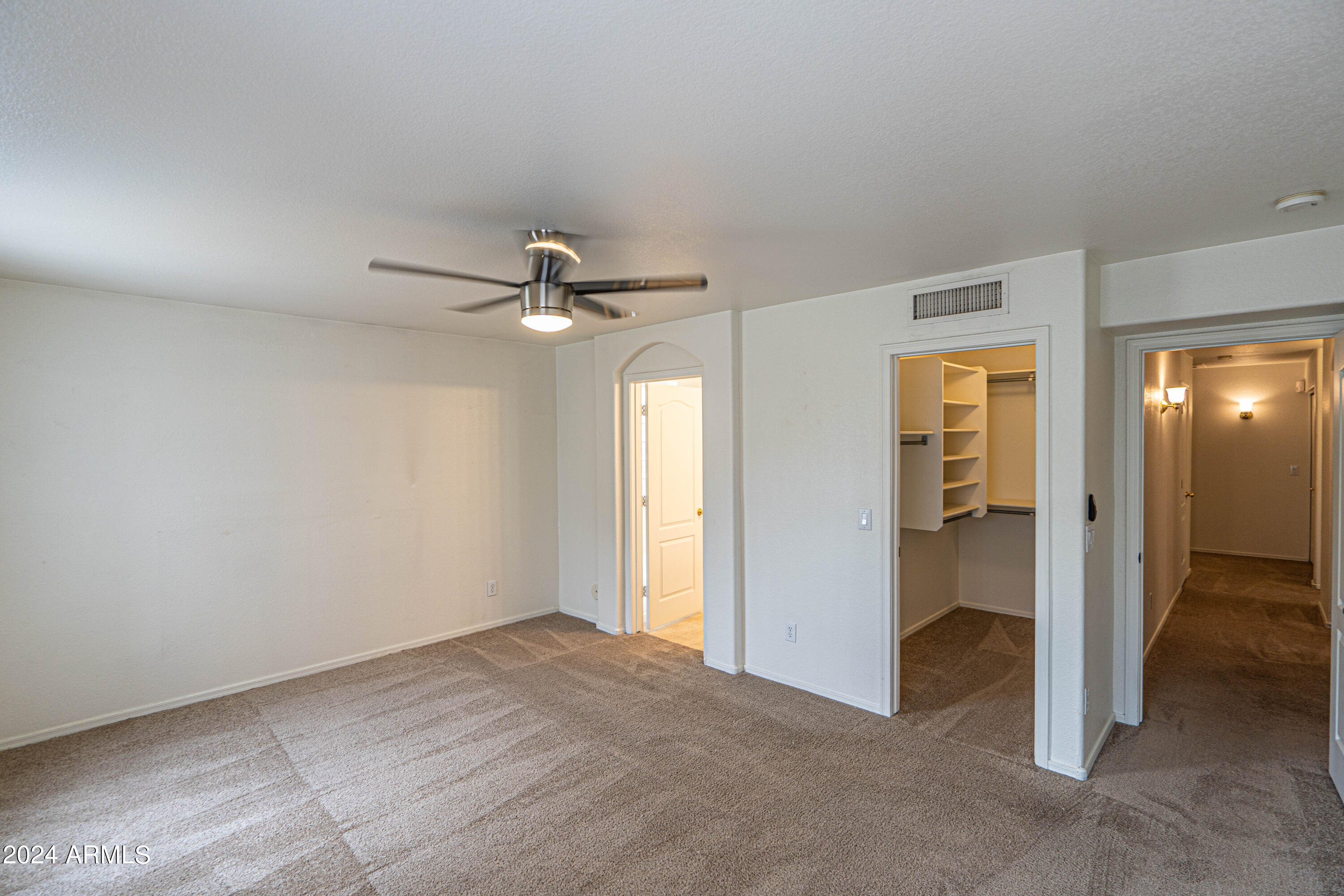 1729 East Del Rio Street Gilbert, AZ 85295 - Photo 9 of 19 an empty room with closet and a chandelier fan