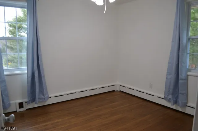 a bathroom with a shower and a toilet