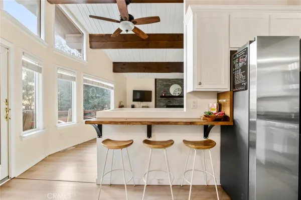 a kitchen with stainless steel appliances granite countertop a refrigerator stove microwave and sink