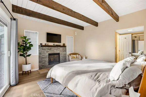 a bedroom with a bed and a night stand