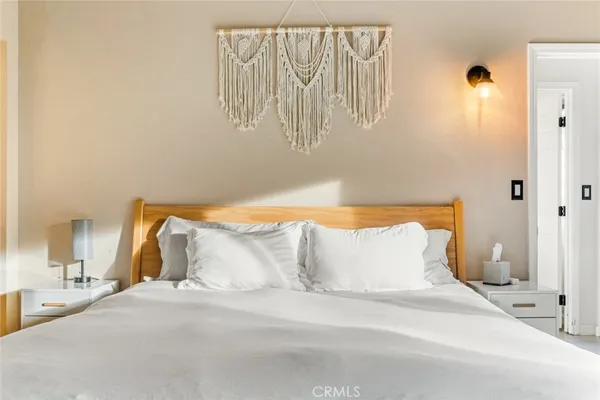 a bedroom with a bed and a fireplace