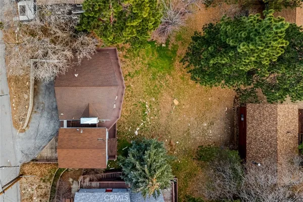 an aerial view of house with yard