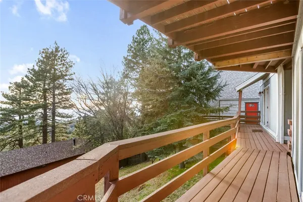 a view of balcony with wooden floor