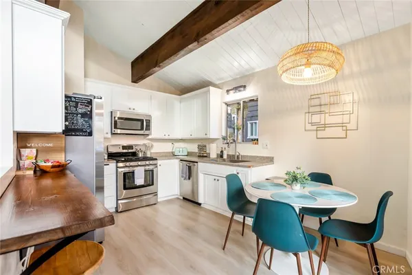 a kitchen with a sink cabinets and appliances