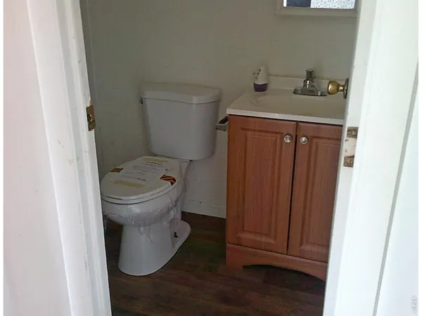 a bathroom with a toilet and a sink