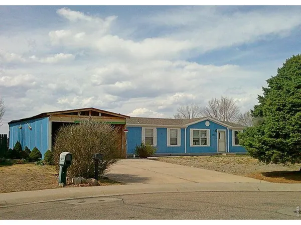 a front view of a house with garage