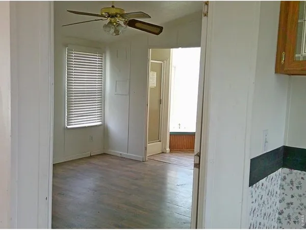 a view of an empty room with a window