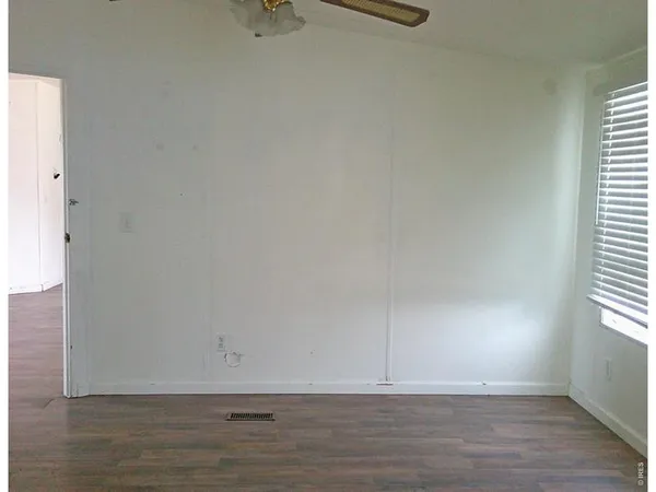 a view of an empty room and window
