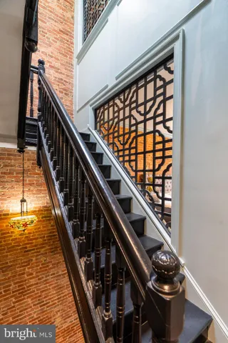 a close view of staircase going with wooden floor and staircase