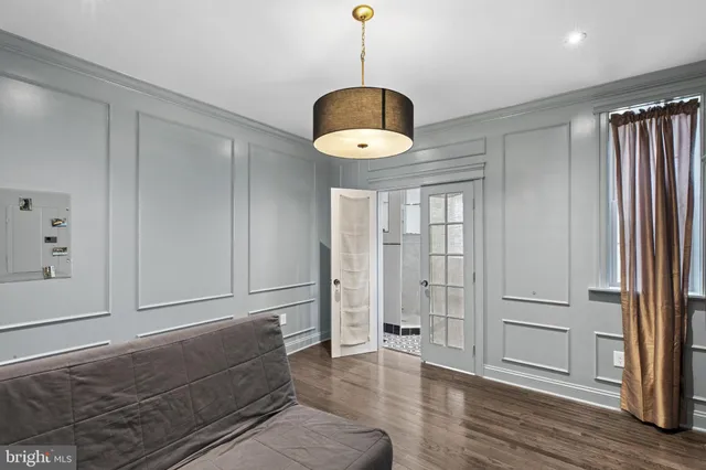 a living room with a furniture and a window