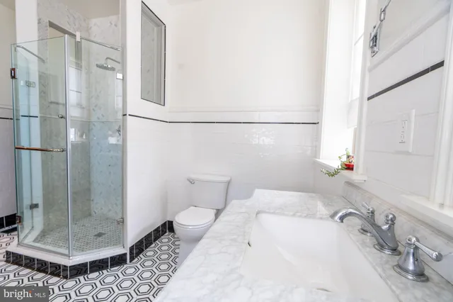 a bathroom with a sink and a shower