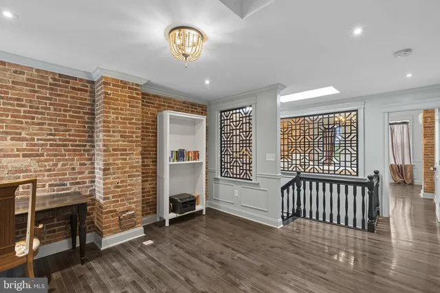 a view of a livingroom with furniture and a window
