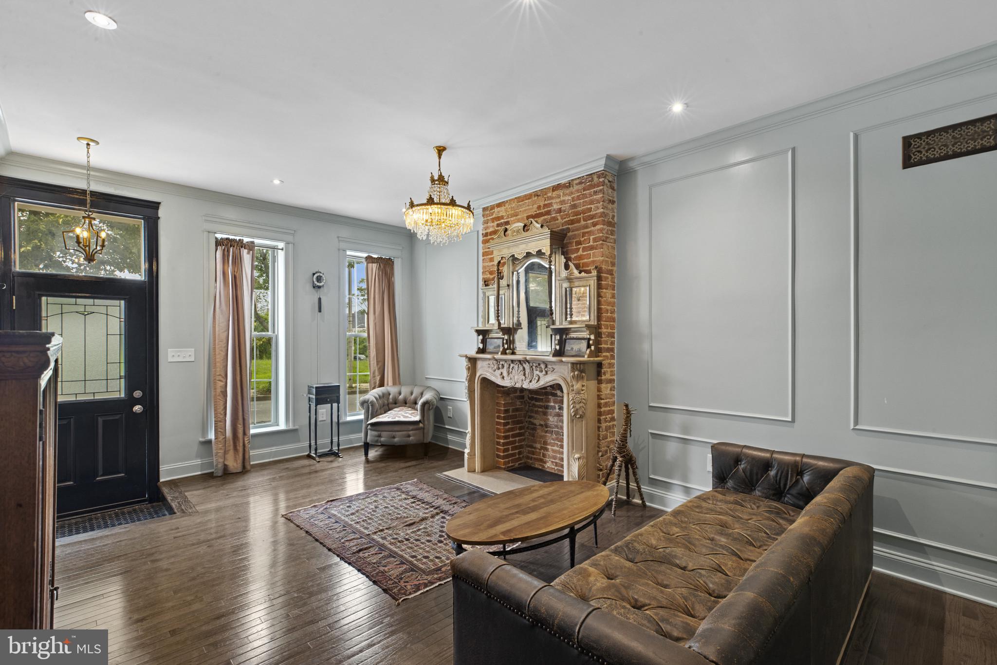 420 East Biddle Street Baltimore, MD 21202 - Photo 3 of 47 a living room with furniture and a fireplace