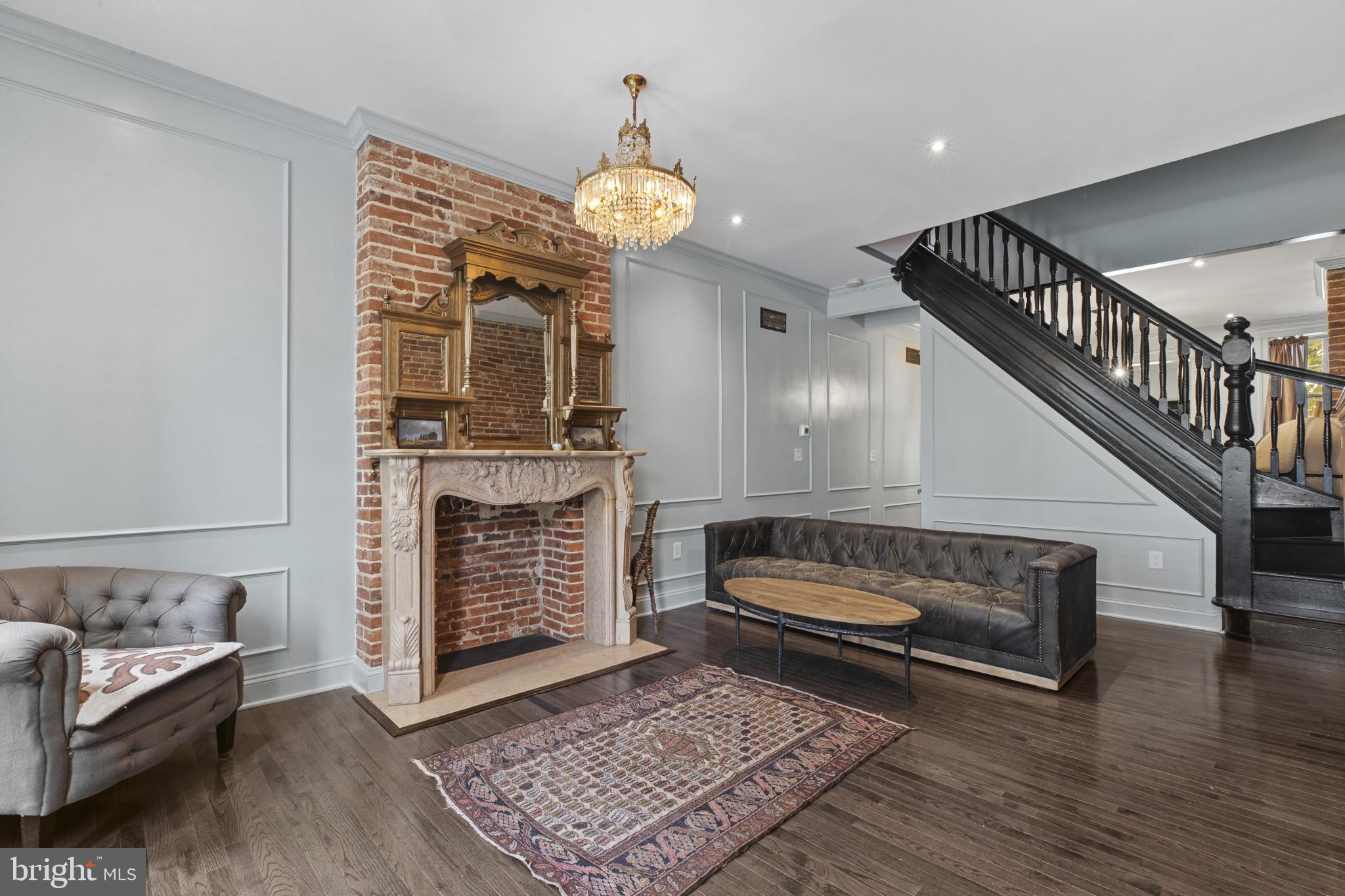 420 East Biddle Street Baltimore, MD 21202 - Photo 6 of 47 a living room with furniture and a fireplace