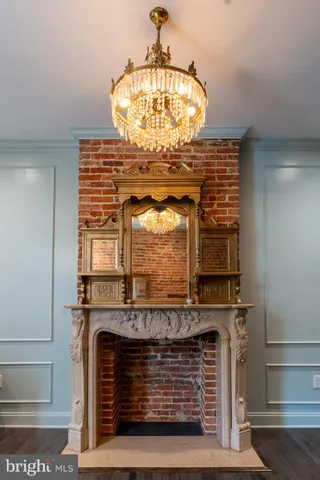 a view of fireplace with chandelier