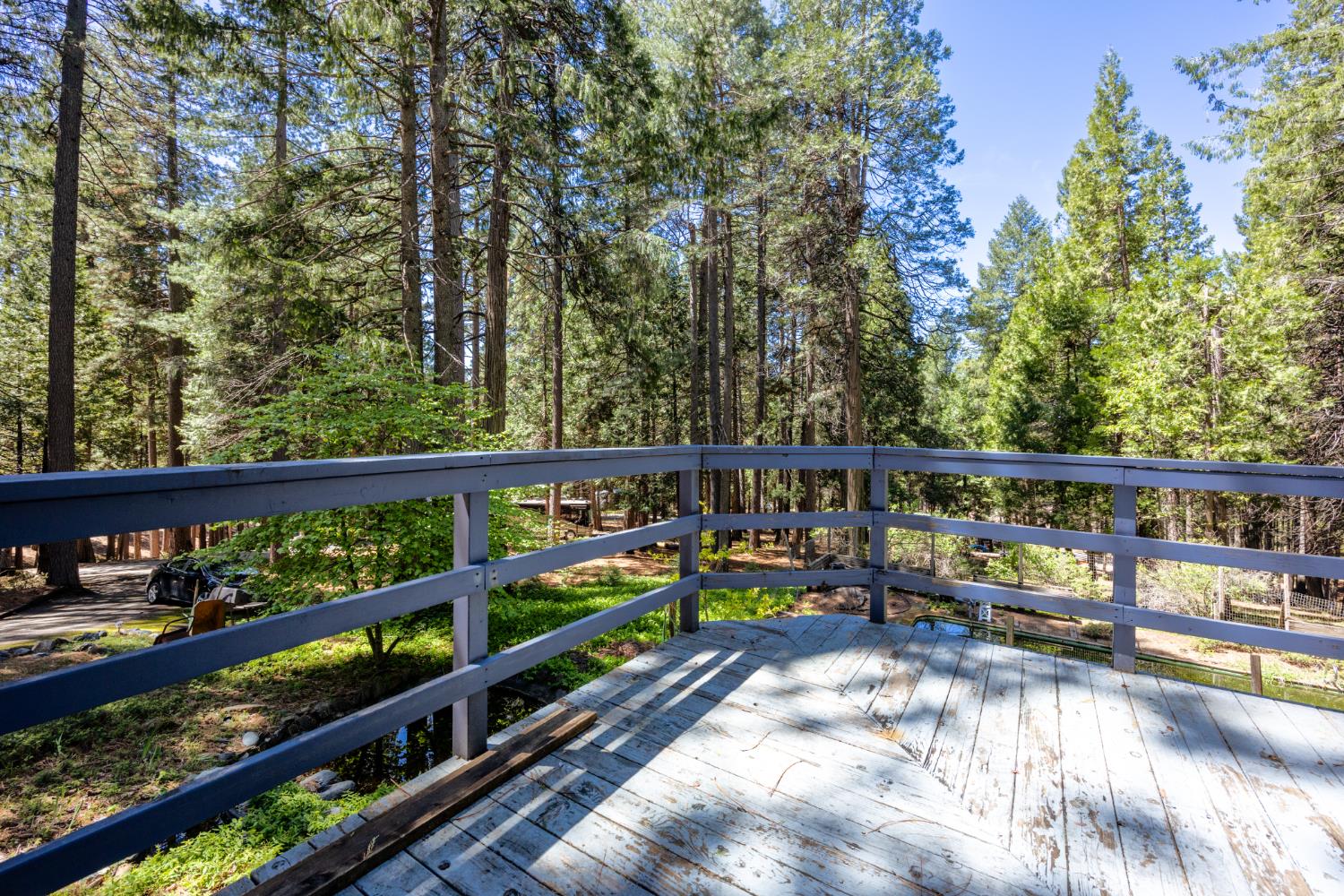 2070 King Of The Mountain Road Pollock Pines, CA 95726 - Photo 37 of 53 a view of a balcony with wooden floor and fence