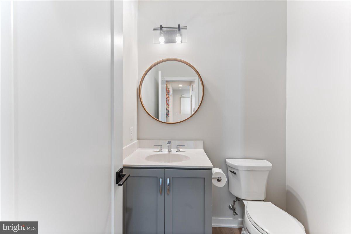 722 Switchman Road Media, PA 19063 - Photo 18 of 46 a bathroom with a toilet a sink and a mirror