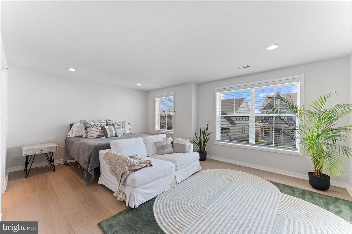 722 Switchman Road Media, PA 19063 - Photo 20 of 46 a spacious bedroom with two beds and a large window