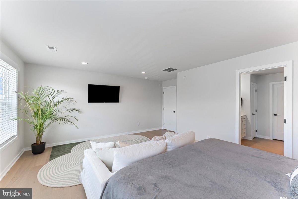 722 Switchman Road Media, PA 19063 - Photo 21 of 46 a bedroom with a bed and a couch