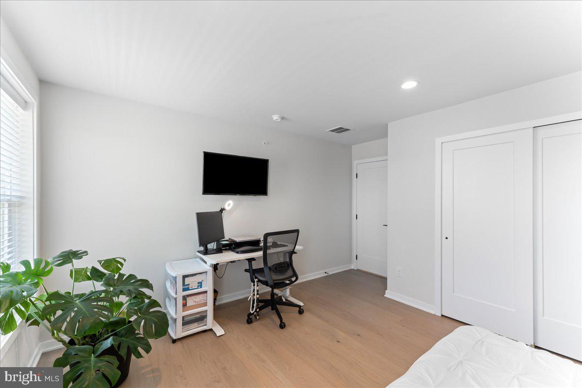 722 Switchman Road Media, PA 19063 - Photo 28 of 46 a view of a workspace with furniture and a potted plant