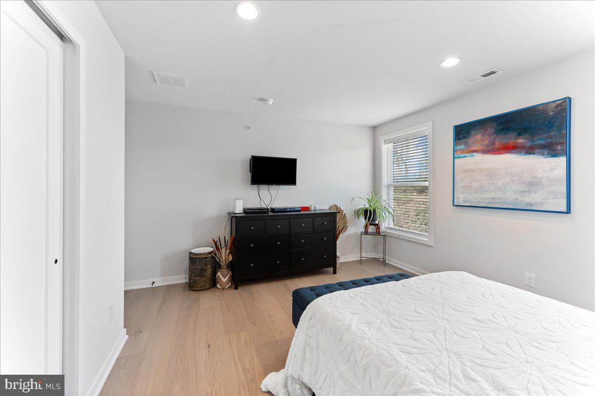 722 Switchman Road Media, PA 19063 - Photo 30 of 46 a bedroom with a bed and a flat screen tv