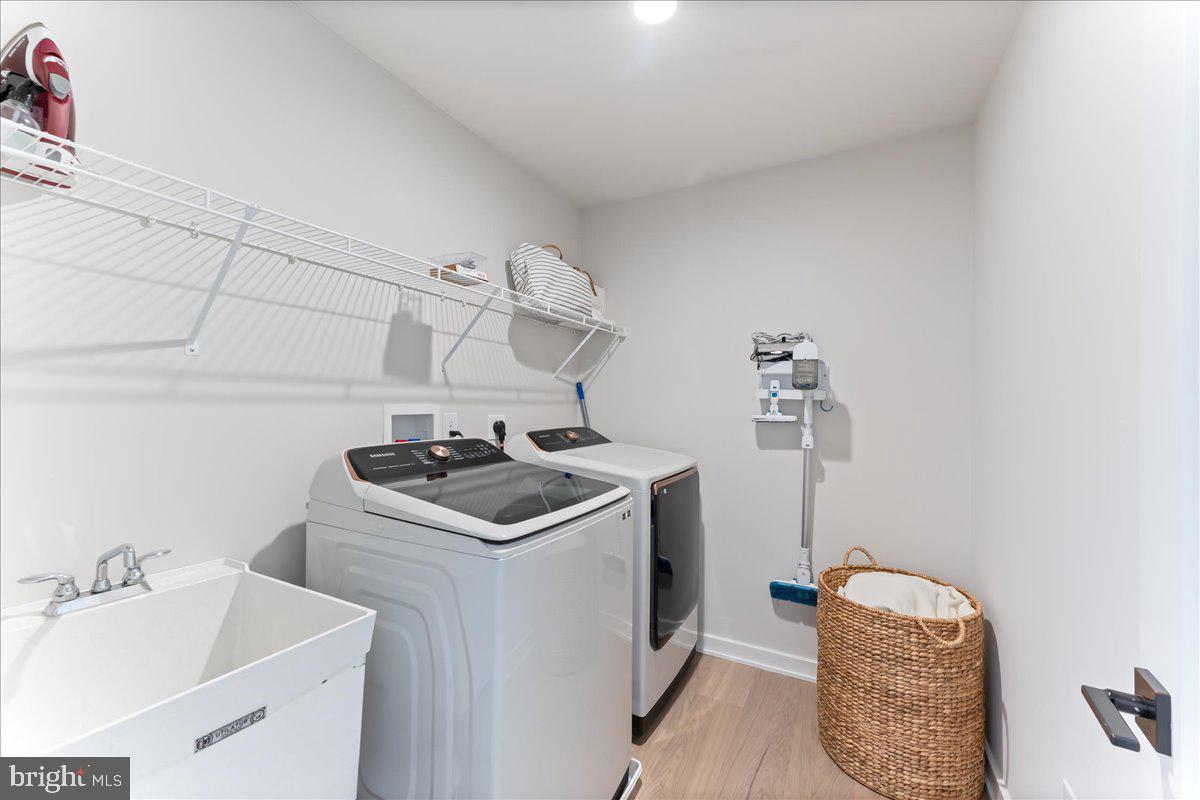 722 Switchman Road Media, PA 19063 - Photo 32 of 46 a utility room with sink dryer and washer