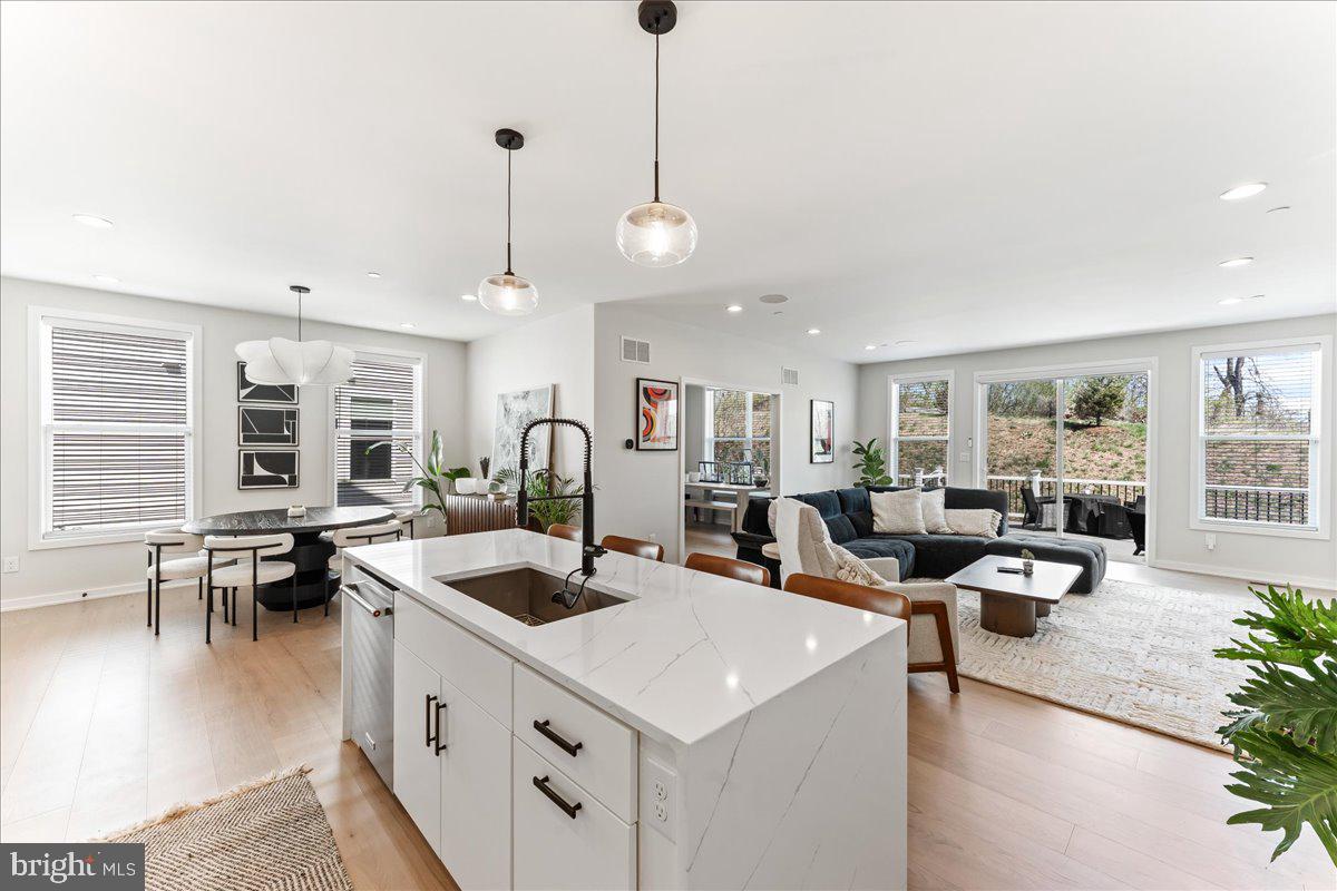 722 Switchman Road Media, PA 19063 - Photo 5 of 46 a living room with granite countertop kitchen island furniture and a chandelier