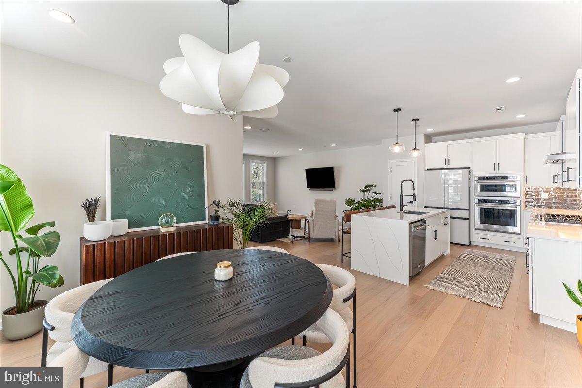 722 Switchman Road Media, PA 19063 - Photo 8 of 46 a living room with furniture kitchen view and a large window