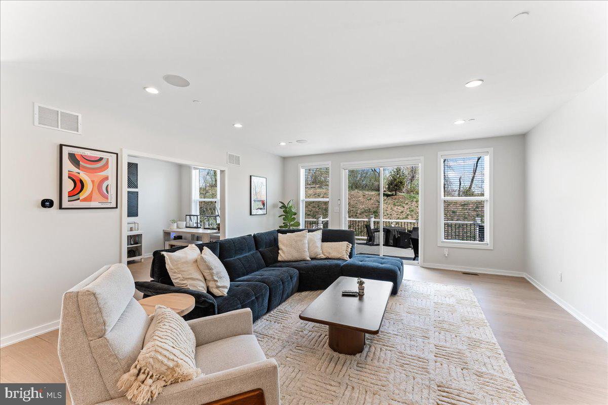 722 Switchman Road Media, PA 19063 - Photo 10 of 46 a living room with furniture and a window