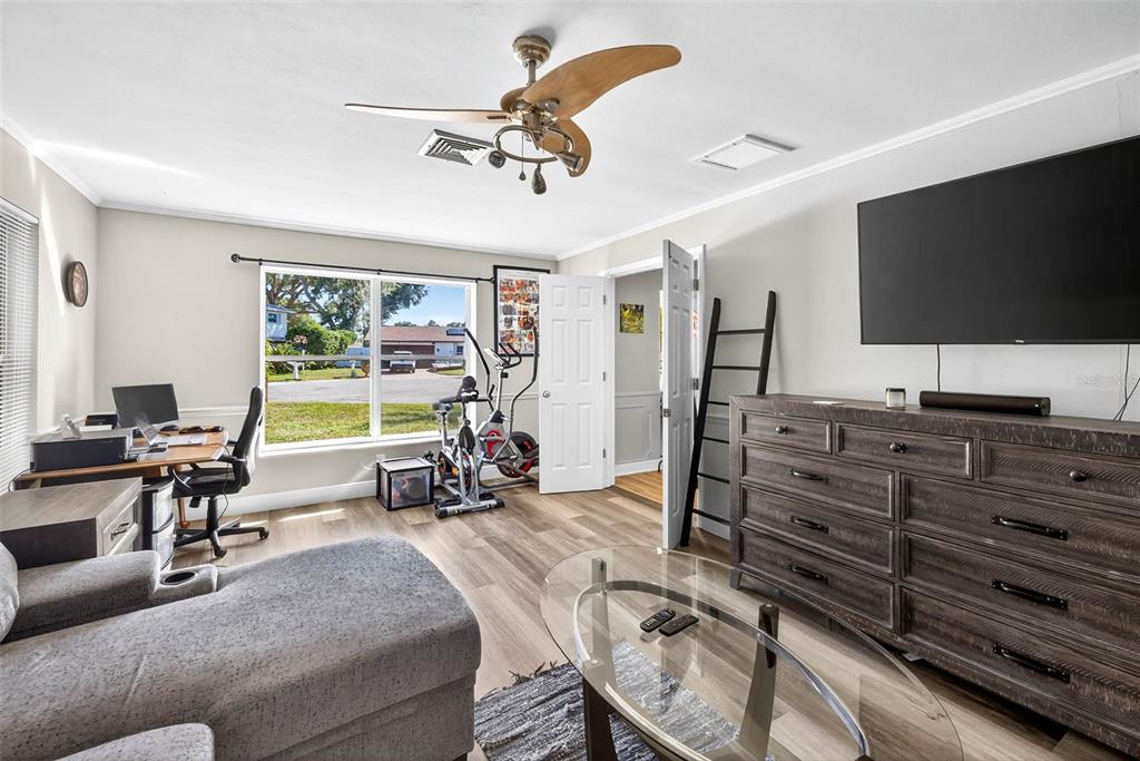 13589 101st Terrace Seminole, FL 33776 - Photo 27 of 43 a view of a livingroom with furniture window and a flat screen tv