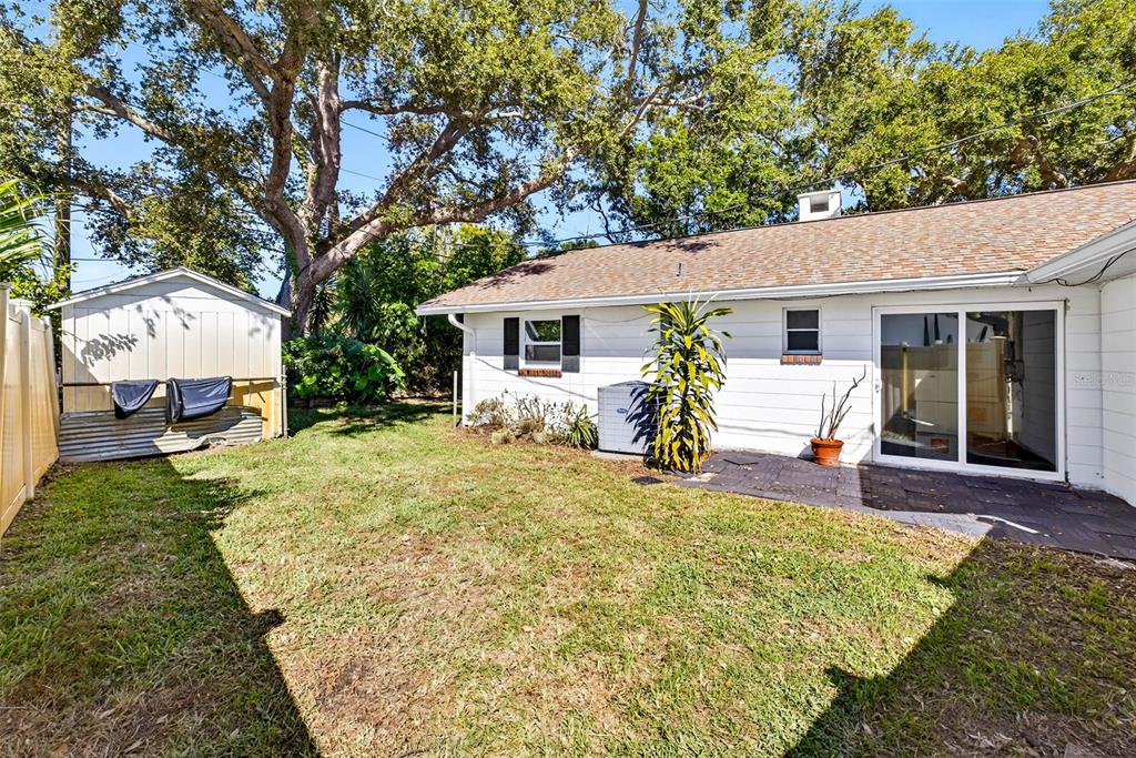 13589 101st Terrace Seminole, FL 33776 - Photo 41 of 43 a view of a house with backyard and sitting area