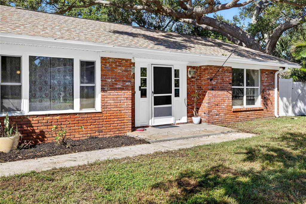 13589 101st Terrace Seminole, FL 33776 - Photo 6 of 43 a front view of a house with a yard