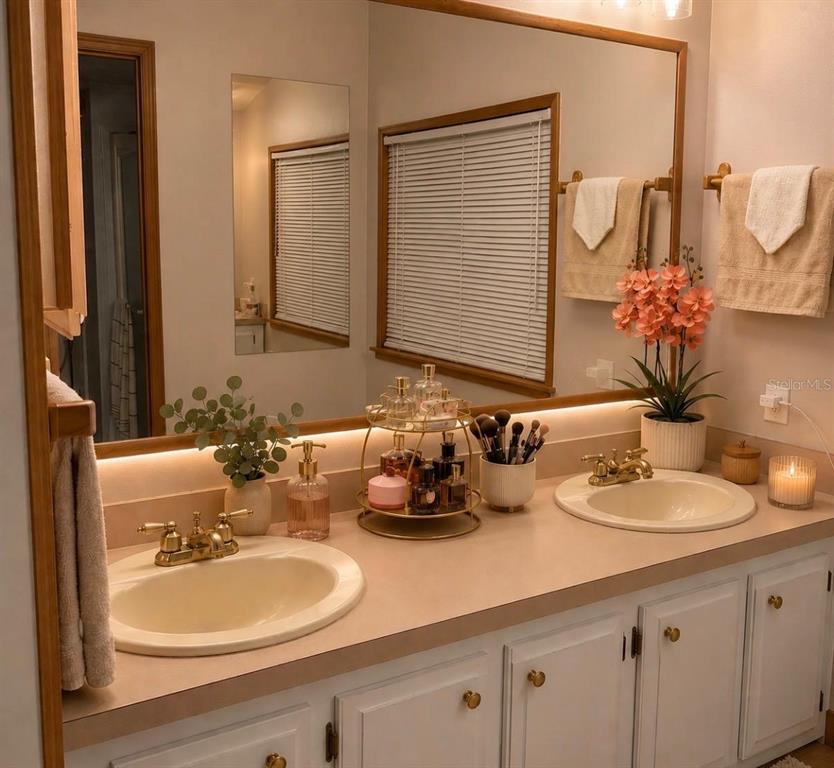 4 Eden Cemetery Road Frostproof, FL 33843 - Photo 15 of 15 a bathroom with double vanity sinks and a mirror