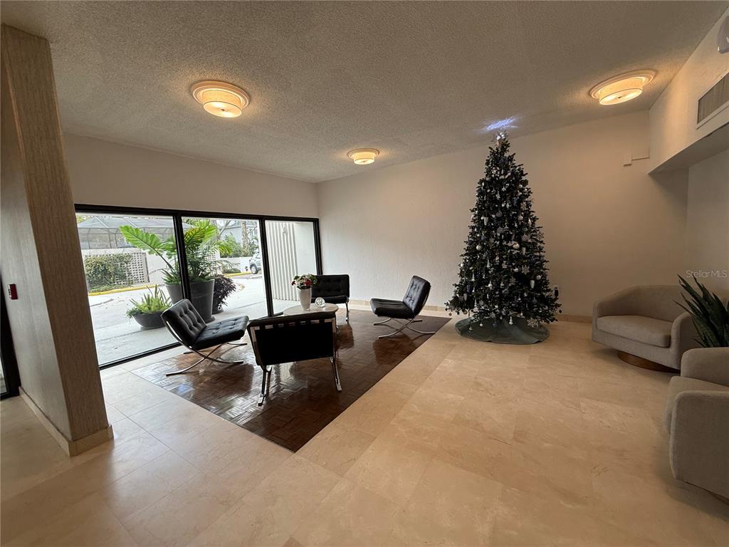 4141 Bayshore Boulevard, Unit 1203 Tampa, FL 33611 - Photo 16 of 16 a living room with furniture and a large window