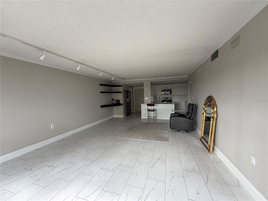 4141 Bayshore Boulevard, Unit 1203 Tampa, FL 33611 - Photo 3 of 16 a view of a livingroom with furniture and a window
